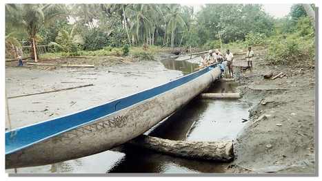 Papa John's photo of a long canoe in Papua New Guinea.