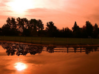 Fall sunrise over park lake